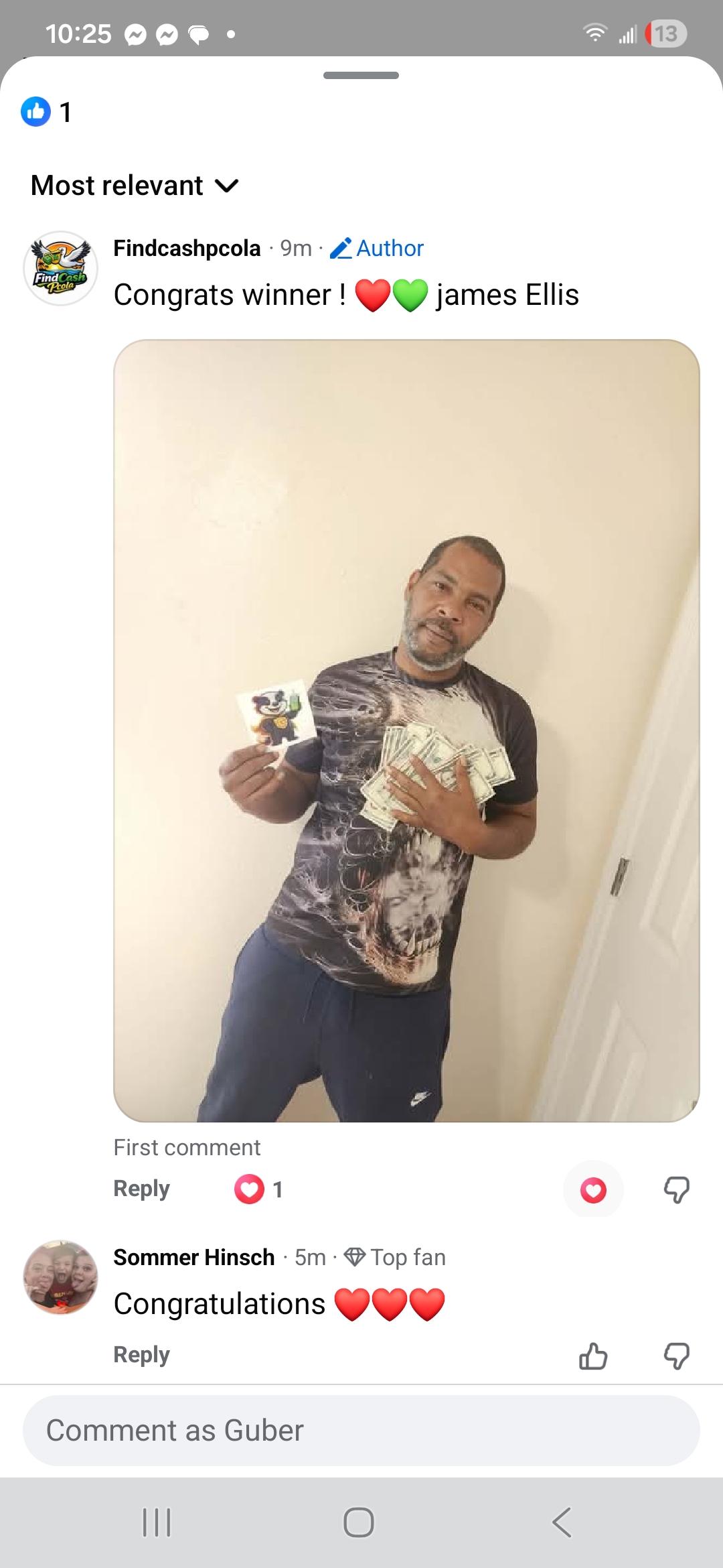 James Ellis holding the cash he found from a GUBER Cash Drop