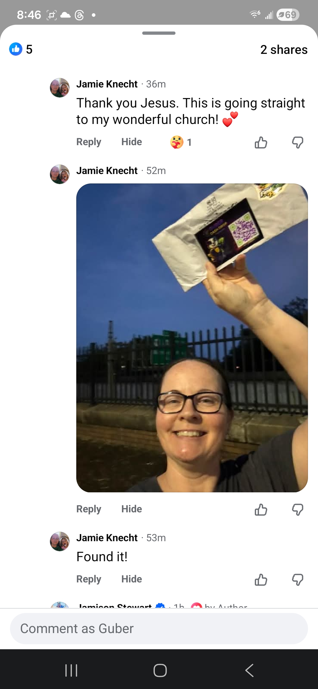 Jamie Knecht holding up a GUBER Cash Drop she found
